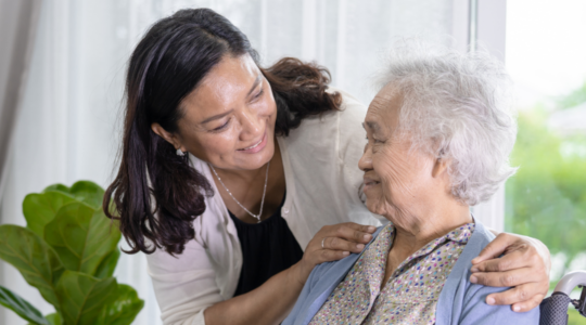 Caregiver-daughter-helping-elderly-mother