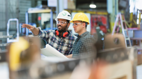 two-construction-workers-planning