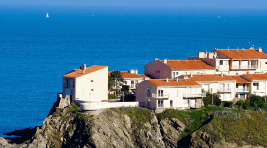 large-house-cliff-water