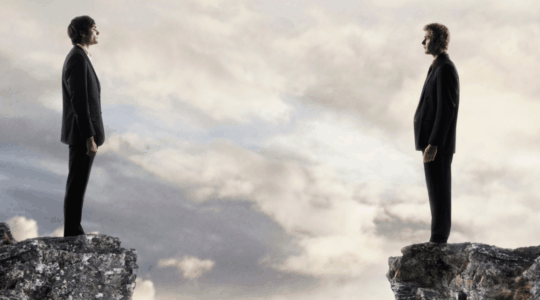 businessmen-facing-each-other-across-gap