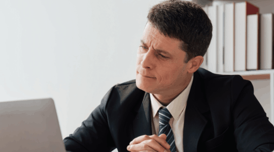 businessman-staring-puzzled-at-laptop